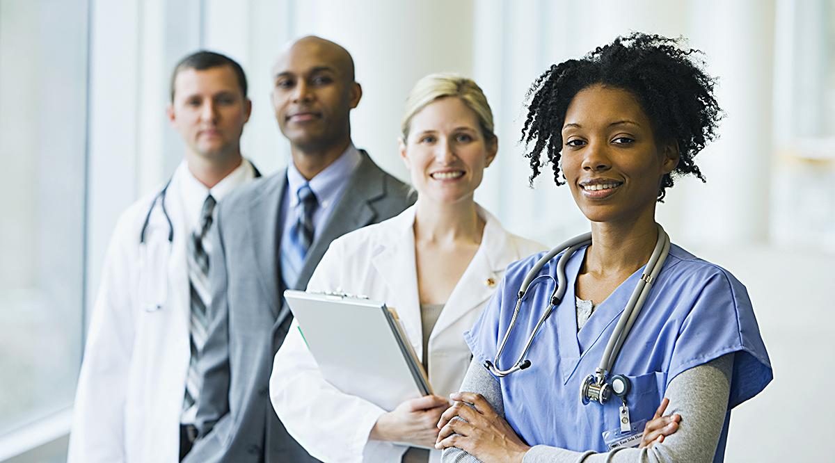 Group of medical professionals standing in the hallway of a hospital